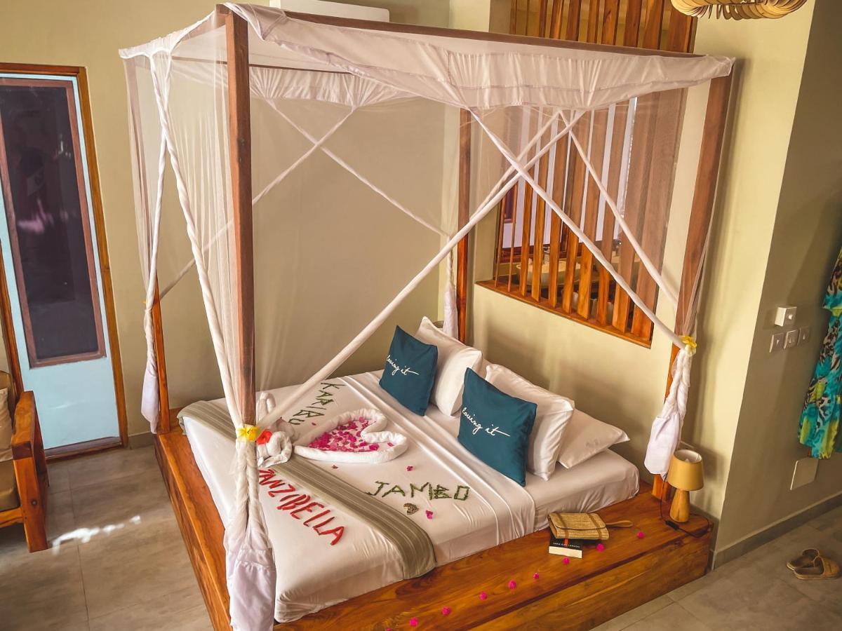 Zanzibella Hotel & Spa Kiwengwa  Bagian luar foto A bed with a mosquito net