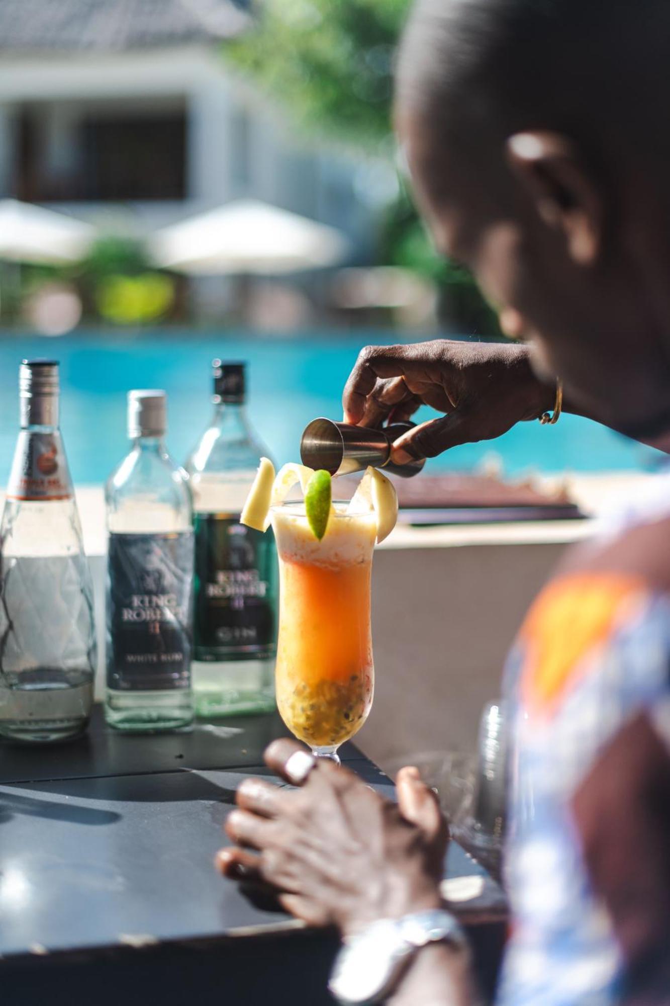 Zanzibella Hotel & Spa Kiwengwa  Bagian luar foto A bartender preparing a cocktail